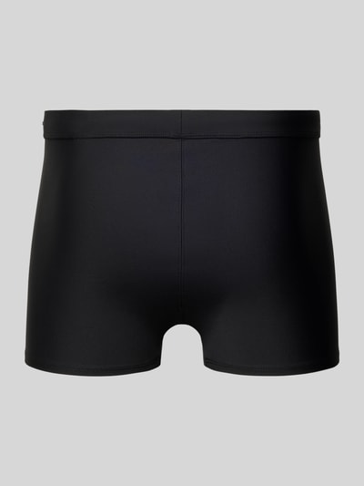 Produktfoto, schwarze Slim Fit Bade-Trunks mit Logo-Detail von Calvin Klein Underwear, elastischer Material-Mix, elastischer Bund.