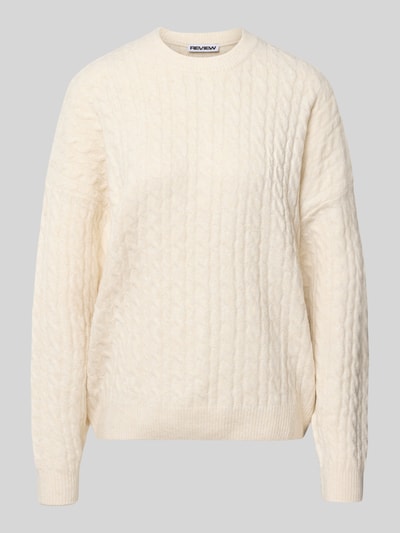 Produktfoto, Oversized Fit Strickpullover mit Zopfmuster von REVIEW, cremefarben, grobe Struktur, elastische Abschlüsse, weiches Material
