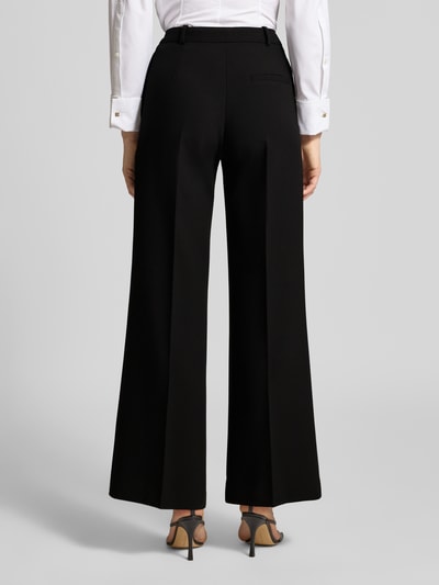 Vrouwenmodel draagt Wide Leg Anzughose met Viskose-Anteil Model 'HASMINA' van HUGO, look: effen, pasvorm: wide leg, sluiting, geheel van achteren