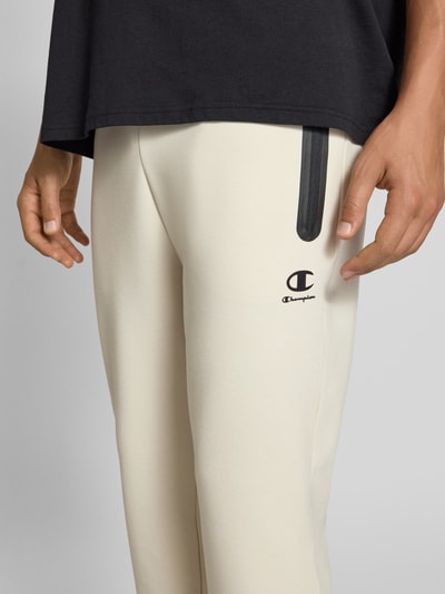 CHAMPION Spodnie dresowe z elastycznym pasem i tunelem Złamany biały 3