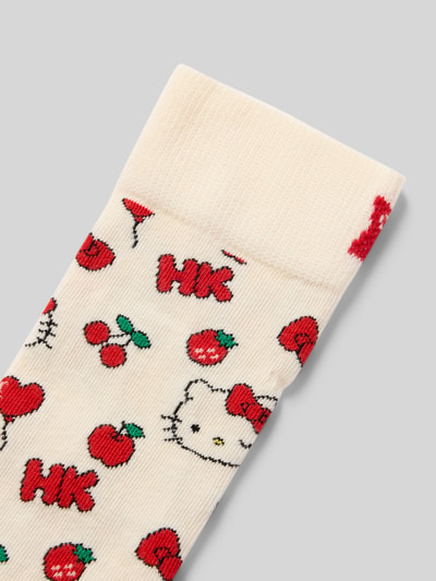 Produktfoto, Socken aus Baumwoll-Mix Modell 'HELLO KITTY CHERRY' von Happy Socks, cremefarben mit rotem Kirschmotiv, elastisches Rippenbündchen, Label-Detail