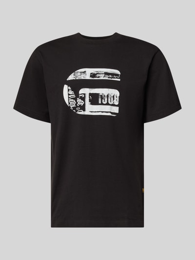 Produktfoto, schwarzes Regular Fit T-Shirt mit weißem Logo-Print, Modell 'icon' von G-Star Raw aus reiner Baumwolle, Rundhalsausschnitt.