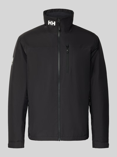 Produktfoto, czarna Midlayer Jacke mit Stehkragen Modell 'CREW' von Helly Hansen, prosty krój, logo, kieszenie na zamek, gładka tekstura