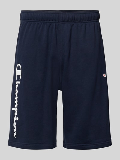 Produktfoto, Shorts mit Logo-Print und -Stitching von CHAMPION aus dunkelblauem Baumwoll-Mix mit elastischem Bund und lockerem Schnitt.