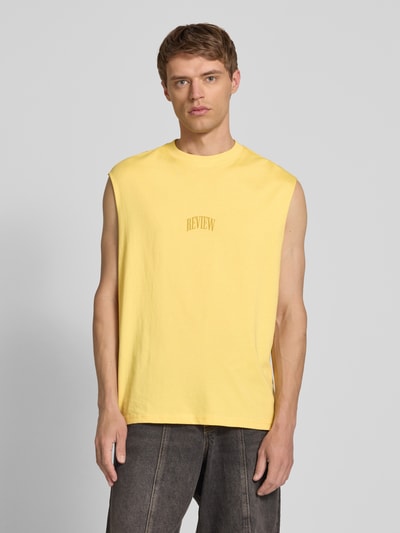 REVIEW Top z nadrukiem z logo Pastelowy żółty 4