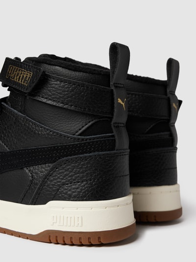 Black and gold store high top pumas