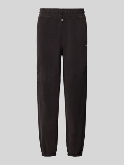 Produktfoto, Relaxed Fit Sweathose mit Logo-Print Modell 'PUMATECH' von PUMA in Schwarz, sportive Textur, Herren Sweathose von PUMA Performance