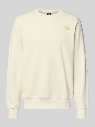 Produktfoto, Sweatshirt mit Label-Print von The North Face in Creme, reine Baumwolle, Regular-Fit, gerippte Abschlüsse, Rundhalsausschnitt.