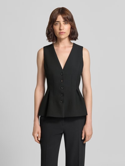 Frauenmodel trägt schwarze Slim Fit Weste mit Viskose-Anteil Modell 'Anena' von HUGO, Damen Weste, Ganzkörperansicht von vorne.