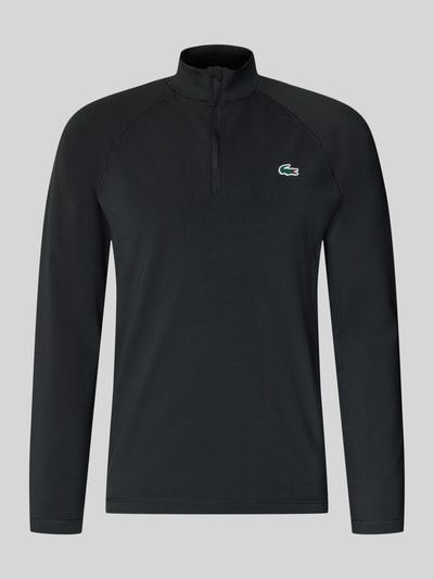 Produktfoto, schwarzes Regular Fit Sport-Langarmshirt mit Ultra-Dry-Technologie von Lacoste Sport, glatte Struktur, Vorderansicht
