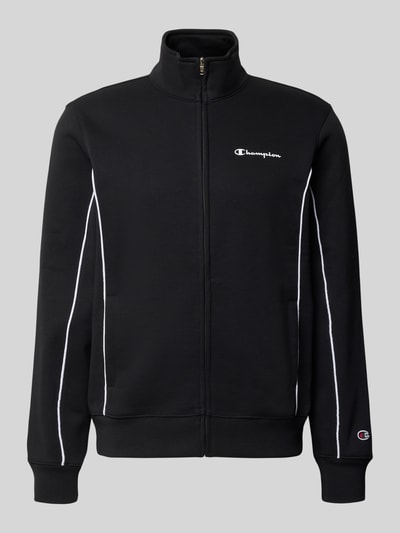 Produktfoto, Trainingsanzug aus Baumwoll-Mix von Champion in Schwarz mit weißen Kontrastnähten, Reißverschluss, Label-Prints und elastischen Abschlüssen.