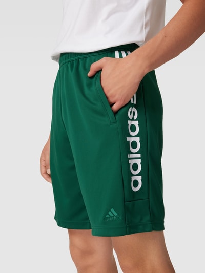 ADIDAS SPORTSWEAR Szorty z dzianiny dresowej z nadrukiem z logo model ‘TIRO’ Butelkowy zielony 3