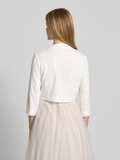 Vrouwenmodel draagt Bolero met open voorkant van Vera Mont, materiaalmix met stretch, recht model, sportmanchetten, ruglengte 42 cm, geheel van achteren