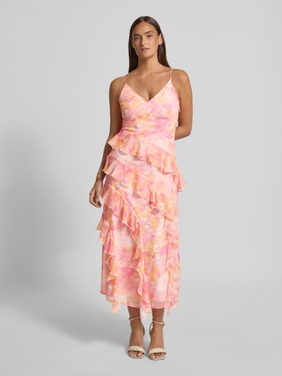 Modelka nosi Figurbetontes Midikleid mit Rüschen Modell 'SMILLA' od Vero Moda w różowo-żółty wzór w grochy z falbanami, tkanina szyfonowa, długość midi, przód, ujęcie całopostaciowe
