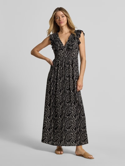 Frauenmodel trägt Leicht ausgestelltes Maxikleid aus reiner Viskose Modell 'EASY JOY' von Vero Moda mit Allover-Muster, Ganzkörperansicht von vorne.