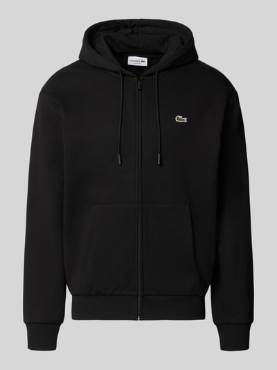 Produktfoto, schwarze Regular Fit Sweatjacke aus Baumwoll-Mix von Lacoste mit Reißverschluss, Kapuze und Kängurutaschen, strukturierte Oberfläche.