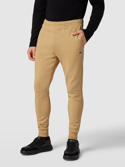 Lacoste Spodnie dresowe z naszywką z logo model ‘TRACKSUIT TROUSERS’ Beżowy 4