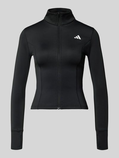 Produktfoto, schwarze Slim Fit Jacke mit Stehkragen von adidas Sportswear, elastischer Material-Mix, Reißverschluss, extralanger Arm, Daumenschlaufen, Logo-Print, glatte Textur