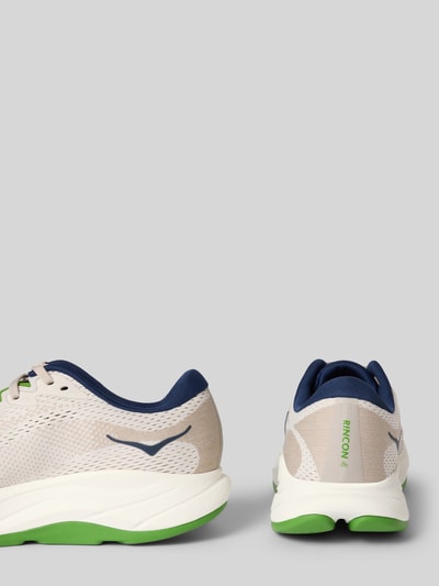 Produktfoto, Sneaker mit Logo-Detail Modell 'RINCON' von HOKA in Beige, Dunkelblau und Grün, runde Passform, Schnürverschluss, Absatzhöhe 4 cm, Schafthöhe 8 cm, Schaftweite 9 cm, Herrensneaker mit strukturierter Oberfläche und zweifarbig profilierter Sohle.
