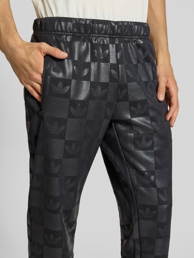 adidas Originals Regular fit sweatpants met all-over logoprint, model 'Reg' Zwart - 3