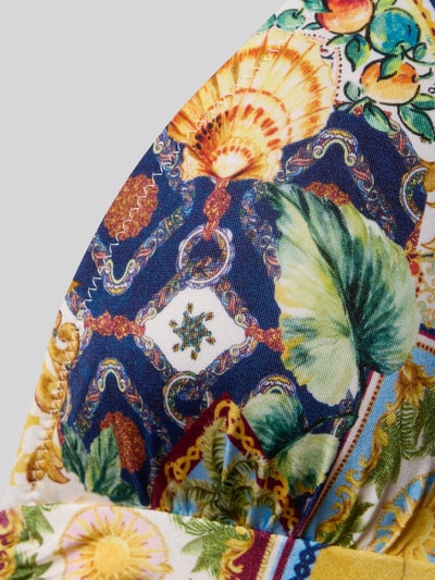 Frauenmodel trägt Badeanzug mit tiefem V-Ausschnitt Modell 'TREASURED TROVE' von WATERCULT aus farbenfrohem Material-Mix mit Stretch-Anteil, Nahaufnahme Oberkörper.