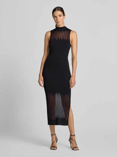 Frauenmodel trägt enganliegendes Freizeitkleid aus Viskose-Mix Modell 'Sieffily' von HUGO, schwarzer Stoff mit transparenten Akzenten, Ganzkörperansicht von vorne, Damen Freizeitkleid von HUGO.