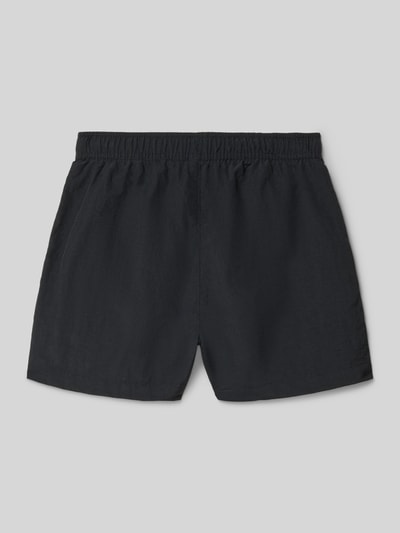 Productfoto, Badehose mit Eingrifftaschen und Logo-Print van CHAMPION voor kinderen, loose fit, elastische band met trekkoord, zij-steekzakken, logoprint, effen zwart, rechte pijpen, gladde textuur