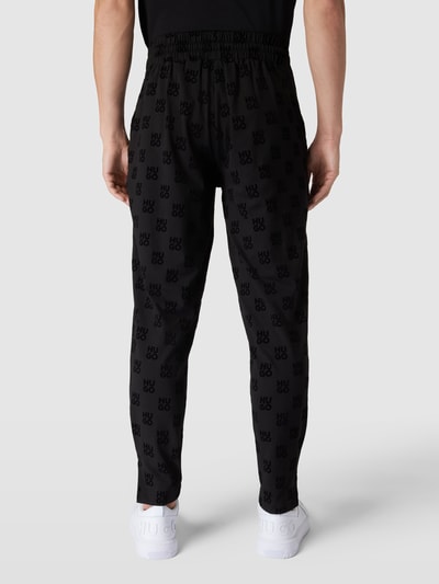 HUGO Sweatpants mit Allover-Logo-Muster Modell 'Flock' Black 5