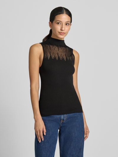 Frauenmodel trägt Slim Fit Top mit Mock Neck Modell 'Sieffy' von HUGO in Schwarz mit transparentem Muster, Ganzkörperansicht von vorne, Damen Top von HUGO