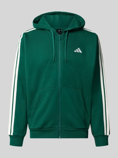 Produktfoto, Regular Fit Sweatjacke aus Baumwoll-Mix von adidas Sportswear in Dunkelgrün mit weißen Streifen und Logo, glatte Textur