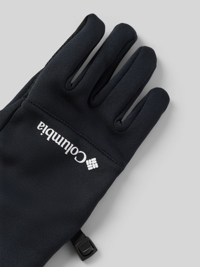 Produktfoto, schwarze Fingerhandschuhe mit weißem Columbia-Logo, glatte Textur, Modell 'CSConnect™ Touch' von Columbia, Material-Mix mit Stretch-Anteil