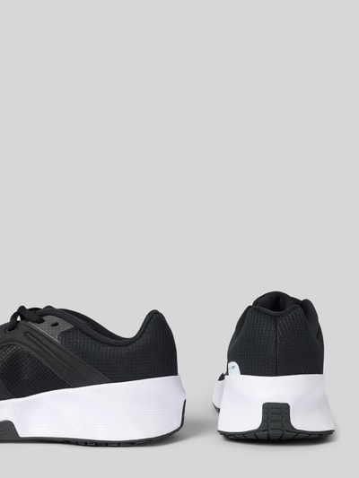 Produktfoto, Sneaker mit Logo-Print Modell 'City' von Nike, schwarze und weiße Farben, abgerundete Passform, Schnürverschluss, Absatzhöhe 5 cm, Schafthöhe 5 cm, Schaftweite 6 cm, Herren Sneaker, strukturierte Oberfläche.