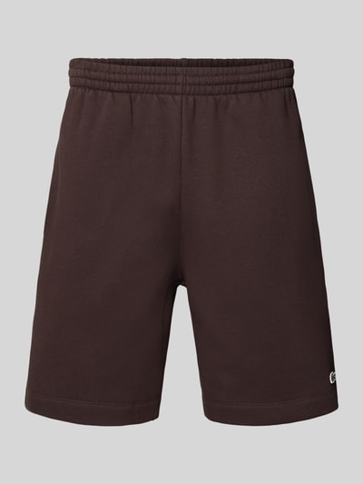 Produktfoto, Regular Fit Sweatshorts aus Baumwoll-Mix von Lacoste in einfarbigem Dunkelbraun, elastischer Bund, seitliche Taschen, Sweat-Textur.