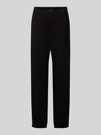 Produktfoto, Basic Sweatpant mit Bündchen am Saum und seitlichen Taschen von Review, schwarze Farbe, Baumwoll-Mix, lockere Passform, elastische Abschlüsse, Logo-Stickerei, Label-Print, glatte Textur, Innenbeinlänge 74 cm in Größe S.