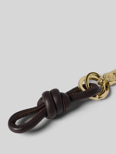 Produktfoto, Schlüsselanhänger mit Knoten-Detail von Abro, donkerbruin leer met gouden Karabijnhaak, Label in reliëf, Dames accessoires