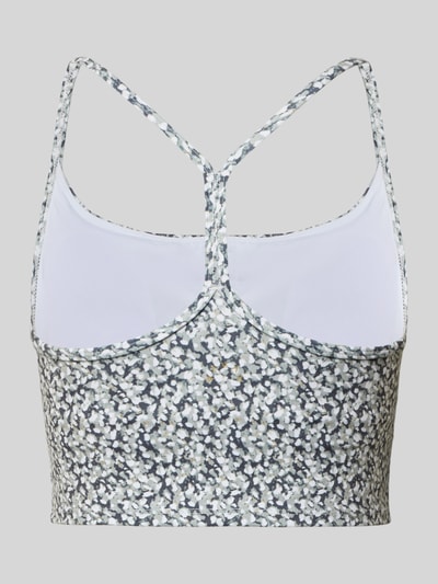 Männermodel trägt Cropped Top mit integriertem bustier Modell 'Harley' von VARLEY aus elastische materiaalmix mit spaghettibandjes, slim fit, korte look met zwart-wit bloemenprint, detailaufnahme rug.