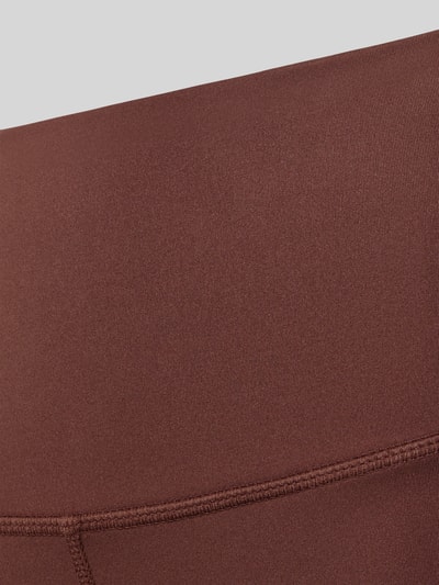 Produktfoto, Leggings von VARLEY in Braun mit elastischem Bund und Kontrastnähten, glatte Textur, elastische Beinabschlüsse