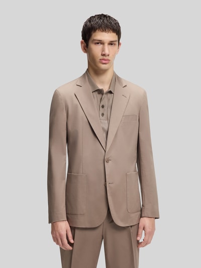 Männermodel trägt Slim Fit Sakko aus katoenmix model 'HANFRED262X' van HUGO in effen kleuren, reverskraag, 2-knoopsluiting, opgestikte zakken, webware; Ganzkörperansicht van voren