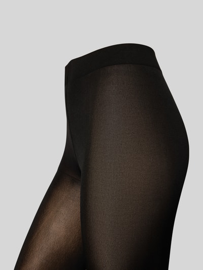 Vrouwenmodel draagt Strumpfhose met elastischem Bund van Falke, zwart, semitransparant, nauwsluitend, detailopname heupen.