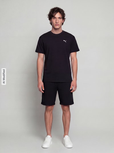 PUMA Performance t-shirt o kroju regular fit z technologią drycell model 'PUMATECH Essentials Tee' Czarny 1