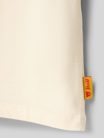 Produktfoto, Regular Fit T-Shirt mit Logo-Patch von Steiff in Creme, glatte Baumwoll-Mix-Textur, Damen T-Shirt mit Rundhalsausschnitt, Rückenlänge 39 cm bei Größe 116.