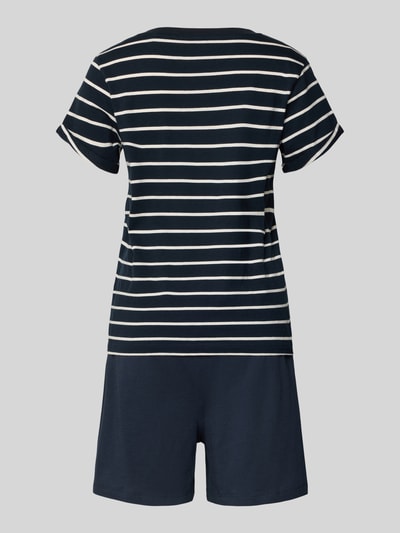 Frauenmodel trägt Regular Fit Pyjama-Set aus reiner Baumwolle von Marc O'Polo in Dunkelblau mit weißen Streifen, Jersey, Ganzkörperansicht Rückansicht.