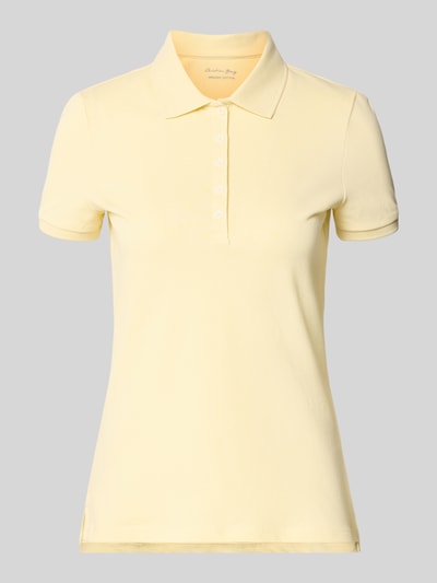 Produktfoto, Slim Fit Poloshirt mit Knopfleiste von Christian Berg Woman aus Baumwoll-Elasthan-Mix in Gelb mit Seitenschlitze, Rückenlänge 62 cm bei Größe S.