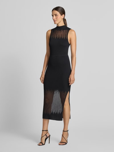 Frauenmodel trägt Enganliegendes Freizeitkleid aus Viskose-Mix Modell 'Sieffily' von HUGO, schwarzer Stoff mit transparenten Details, Ganzkörperansicht von vorne, Damen Freizeitkleid von HUGO.