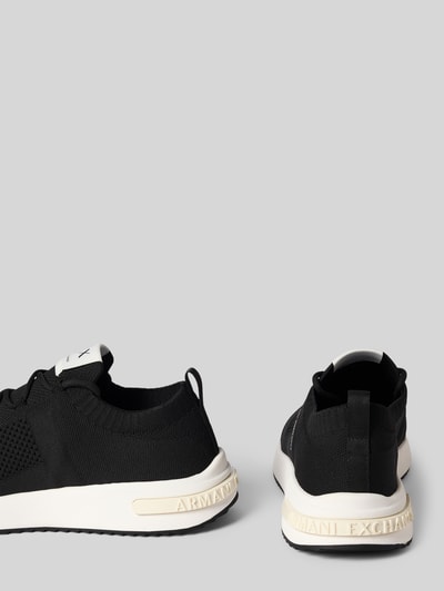 Produktfoto, Sneaker in Schlupfform Modell 'DUSSELDORF' von Armani Exchange, Schwarz mit weißen Label-Details, abgerundete Spitze, Absatzhöhe 3 cm, Schafthöhe 6 cm, Schaftweite 8 cm