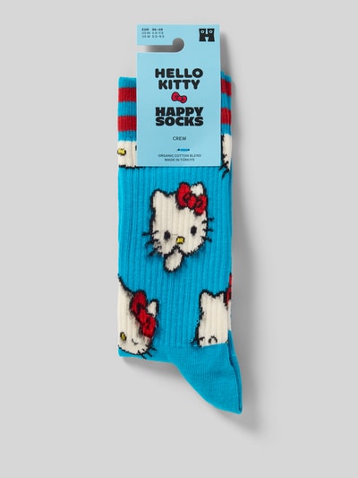 Produktfoto, blaue Socken aus Baumwoll-Mix Modell 'HELLO KITTY SMILES' von Happy Socks mit Hello-Kitty-Muster und rotem Label-Detail. Damen Socken, elastisches Rippenbündchen, Baumwoll-Elasthan-Mix.