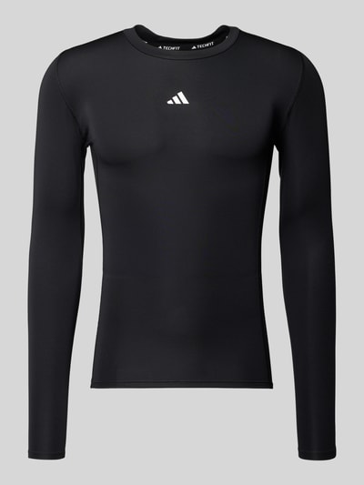 Productfoto, Longsleeve mit Label-Print van adidas Training voor heren, zwart materiaal-mix met stretch, slim fit, geribde ronde hals, label-print, ruglengte maat M 65 cm