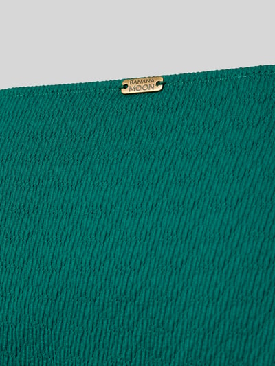 Produktfoto, Bikinibroekje met labeldetail Model 'MASSA' van Banana Moon, materiaalmix met stretch, nauwsluitend model, groene textuur.
