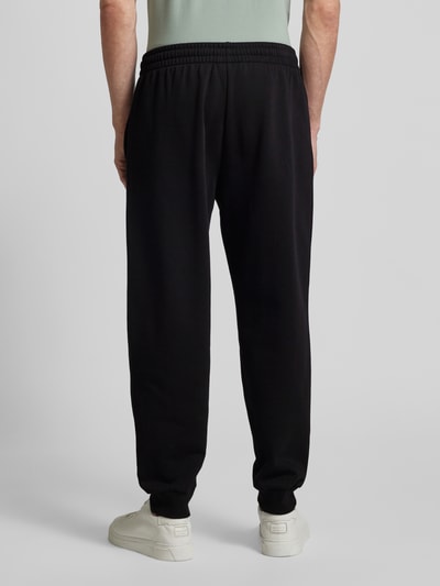 EA7 Emporio Armani Relaxed Fit Sweatpants mit Label-Print Modell 'TRAIN VISIBILTY' Black 5