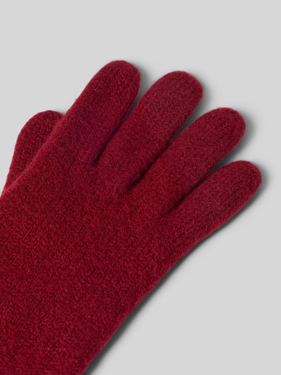 Produktfoto, Walkhandschuhe aus reiner Schurwolle von Roeckl, Damen Handschuhe, rote Strick-Optik, eingefasste Abschlüsse, label-detail, zbliżenie na teksturę